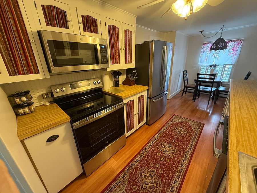 Fully stocked kitchen with new appliances.