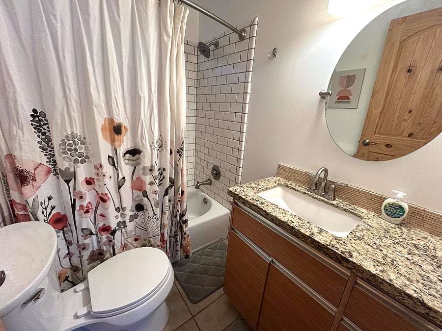 Bathroom with a tub and shower.