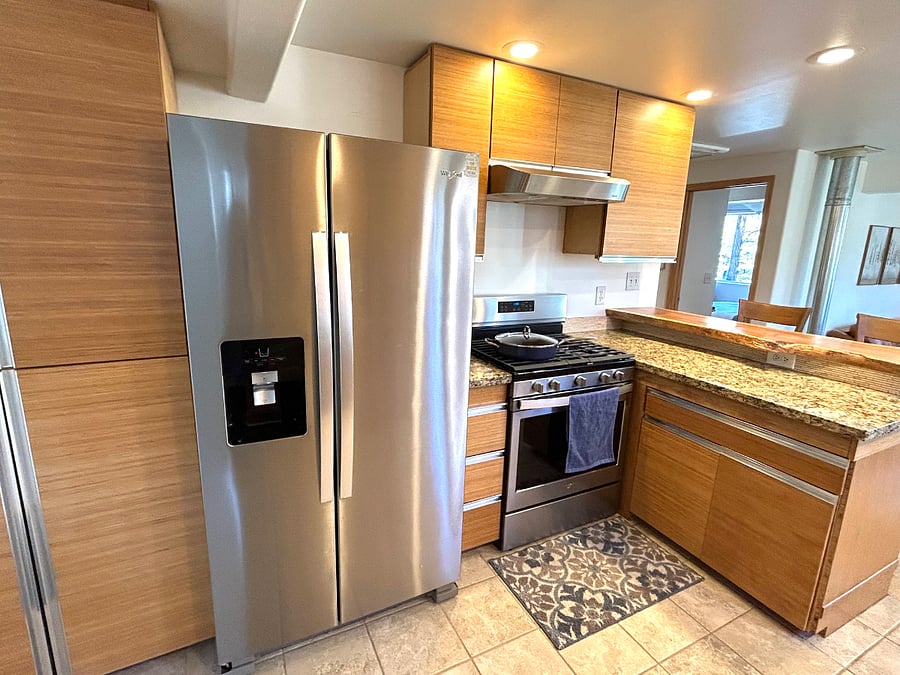 Full-size kitchen open to the living room.