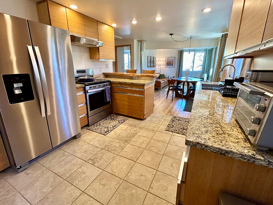Full-size kitchen open to the living room.