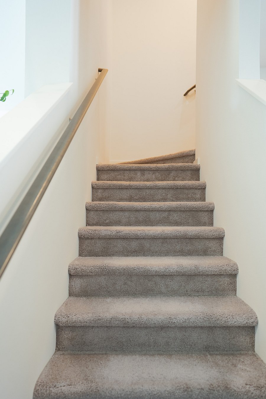 Stairs leading up to third floor