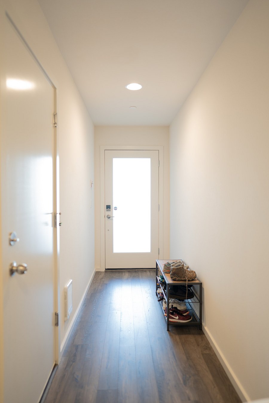 Entryway hallway. Garage door on left.
