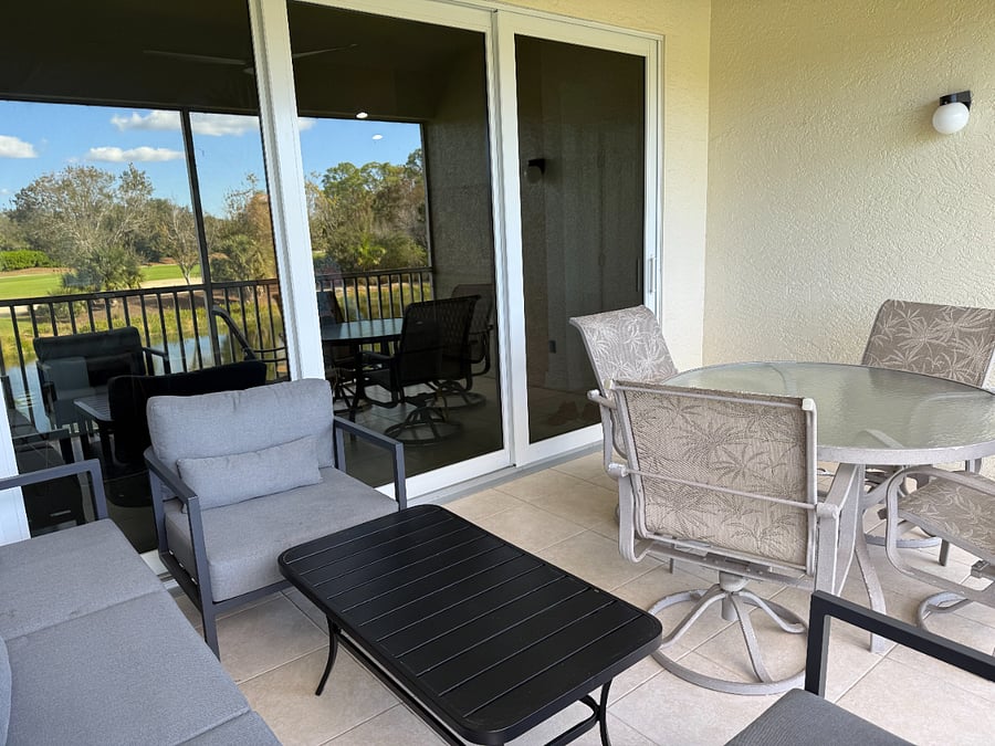 Fully screened with comfortable seating and dining.