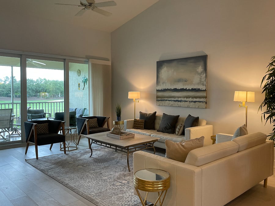 Sunny & serene, our large living room features all faulted ceiling, ceiling fan and comfortable furniture and decor.