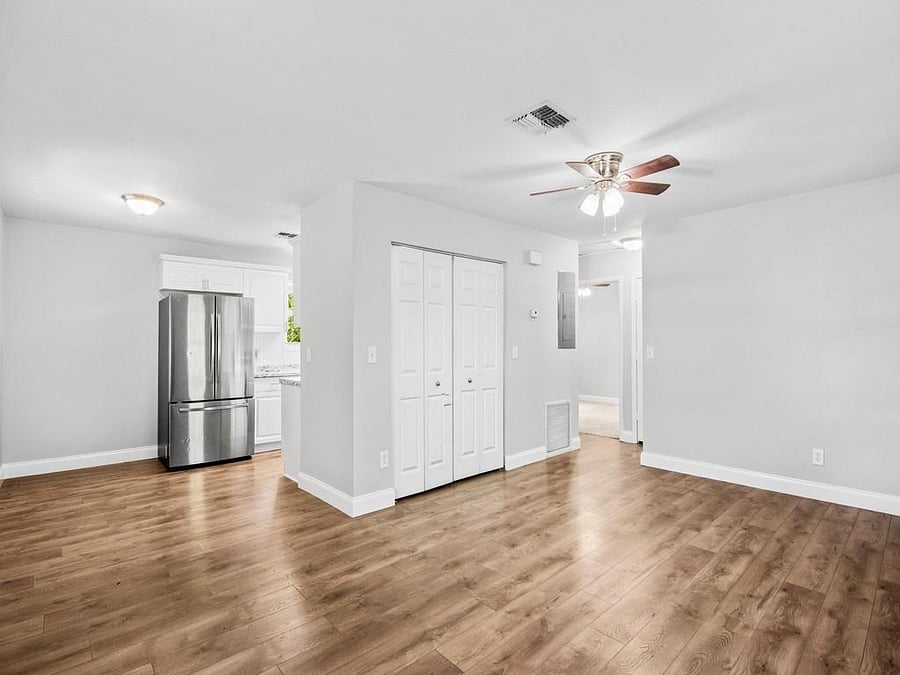 Open living room with access to kitchen
