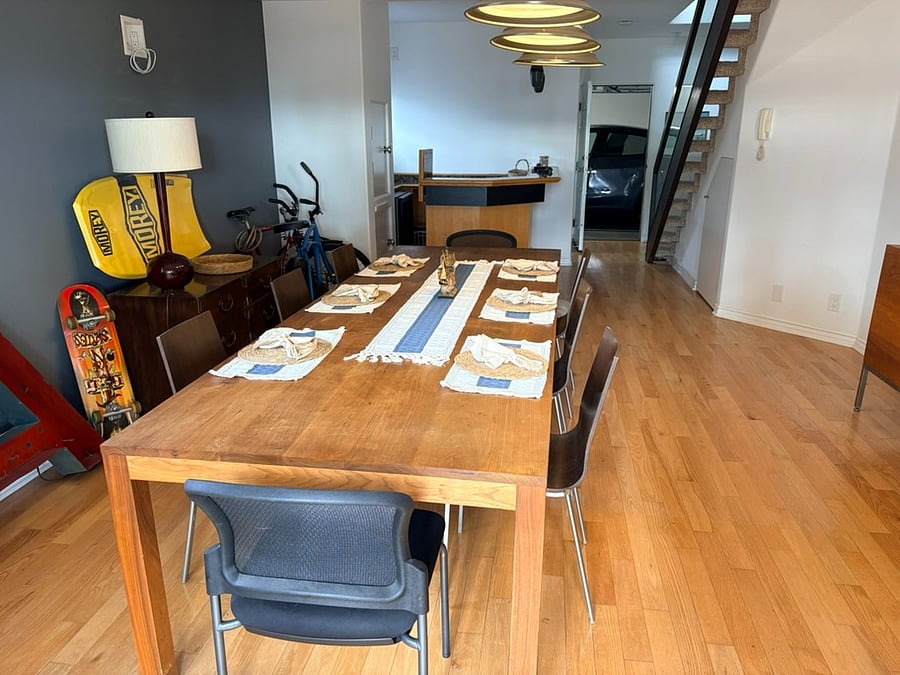 1rst Floor Large dining table, Bar in background on left, connected 2 car garage in back.