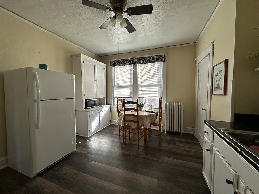 Large kitchen with pots, pans, bowls, etc.