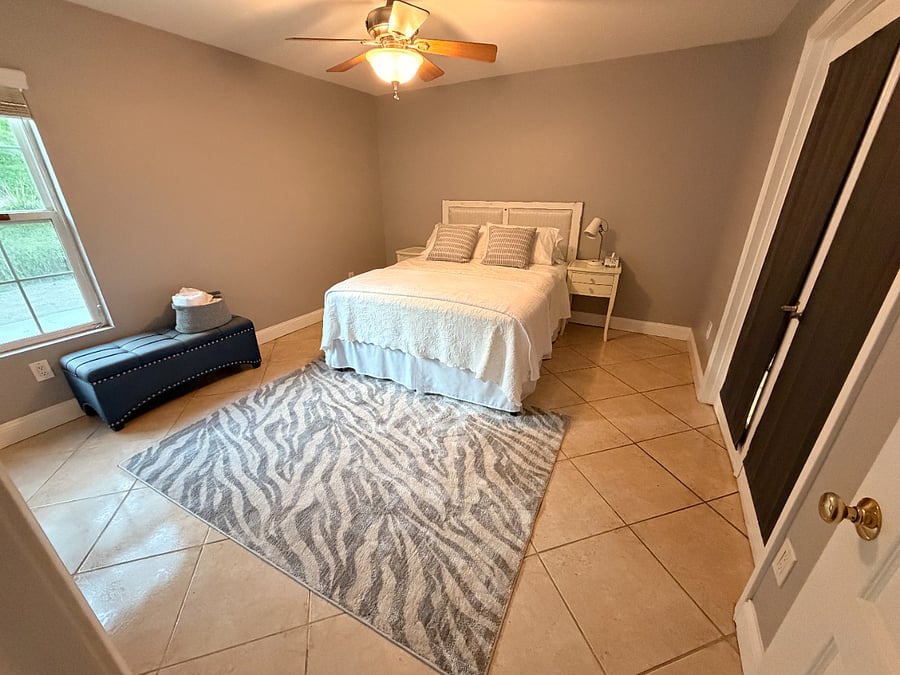Bedroom 1 off kitchen area (french doors) and also has additional door entrance on other side of room.