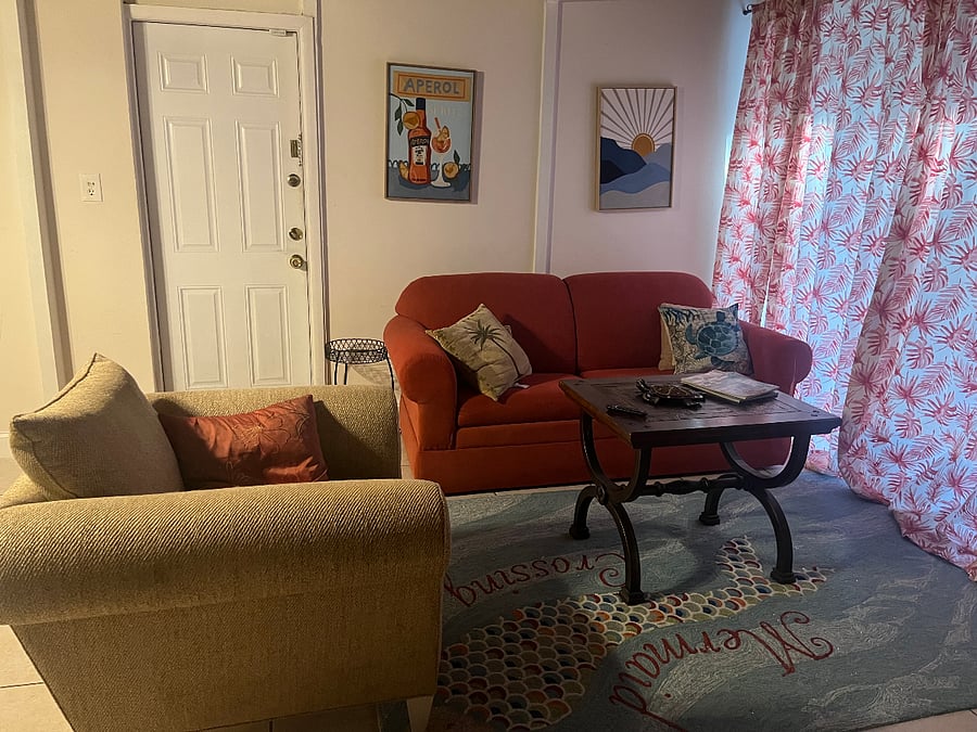 Family room with sliding doors to pool deck, adjacent to billiards/gaming area, with large tv on wheels to serve both spaces. Bonus: can turn tv around to watch from the pool!