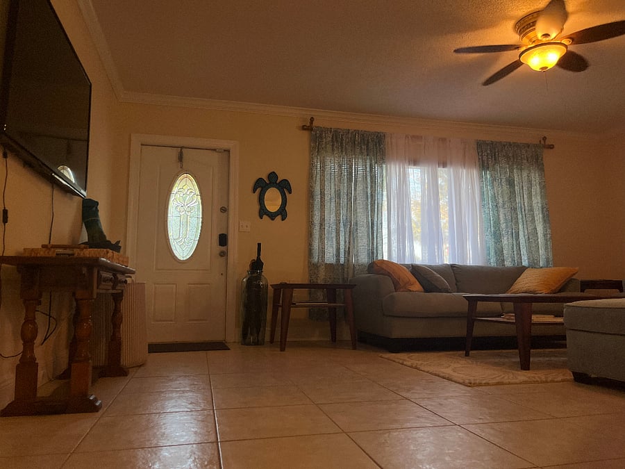 Front door opens to living room, kitchen
