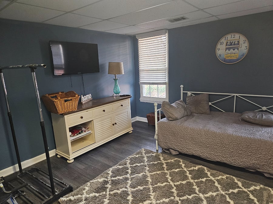 Bonus room with 2 twins a folding table microwave iron toaster oven air fryer refrigerator