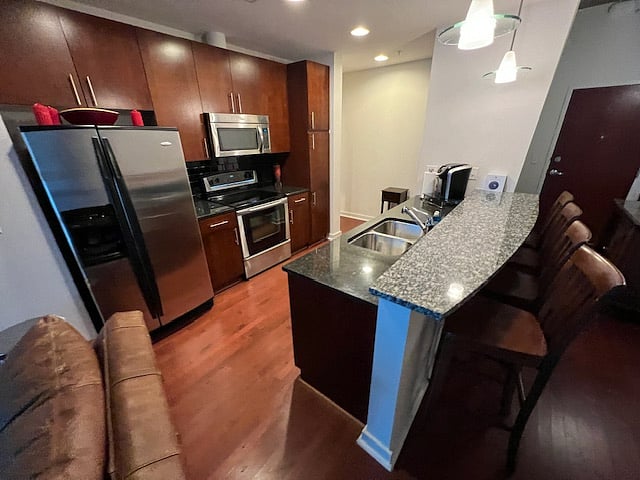 Kitchen with full size refrigerator/freezer and all appliances.