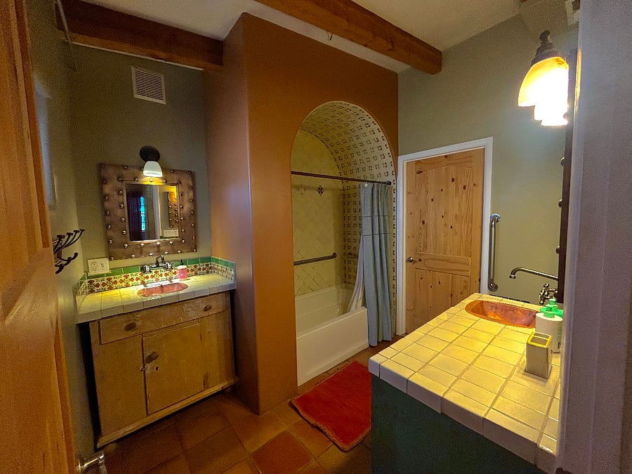 Bathroom with two sinks and tub/shower.