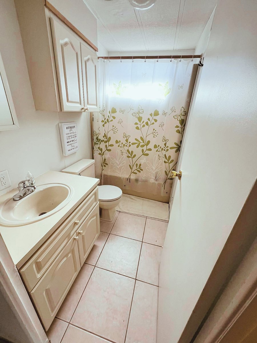 Full bathroom with laundry room.