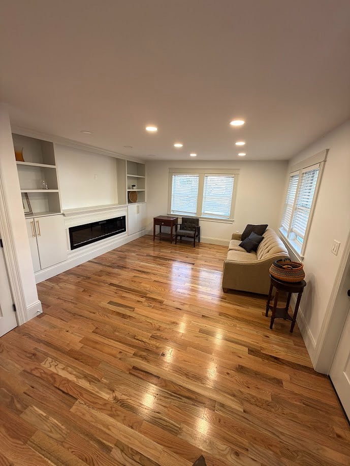 Main Level Living Room w Fireplace and Built Ins for Storage