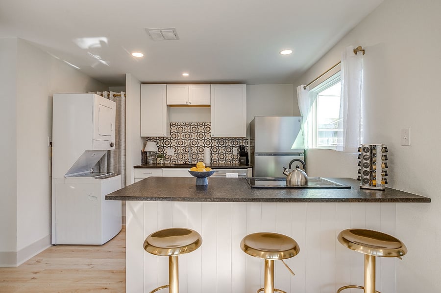 Open concept kitchen and living room - washer/dryer