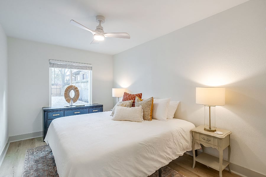 Primary bedroom with king-size bed, walk-in closet