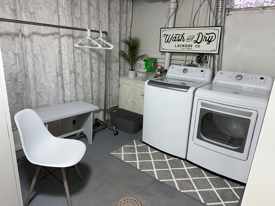 Laundry and Dryer in Basement with hanging rack