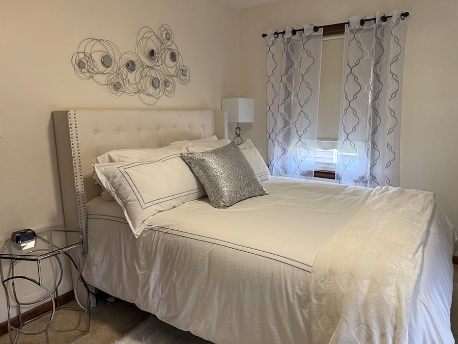 Luxury Queen Size Bed with pillow top mattress and 4 luxury pillows.  Each room contains full size mirror, closet with hangers, chair, bench, dresser, lamps, alarm clock with USB, and ceiling fan.