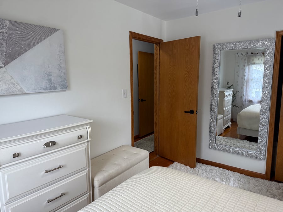 Luxury Queen Size Bed with pillow top mattress and 4 luxury pillows.  Each room contains full size mirror, closet with hangers, chair, bench, dresser, lamps, alarm clock with USB, and ceiling fan.