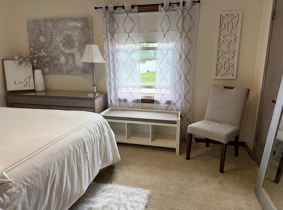 Luxury Queen Size Bed with pillow top mattress and 4 luxury pillows.  Each room contains full size mirror, closet with hangers, chair, bench, dresser, lamps, alarm clock with USB, and ceiling fan.