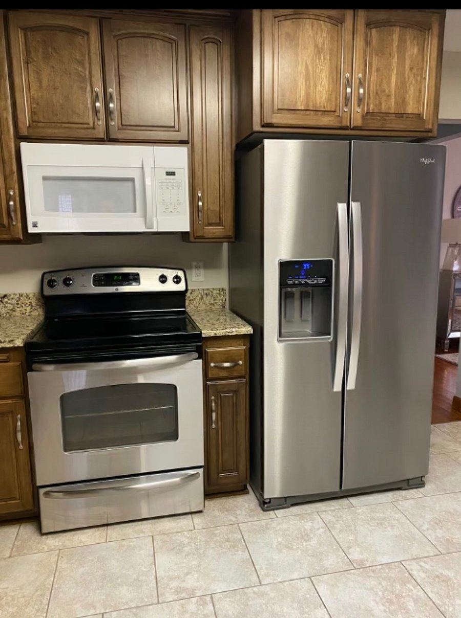 Fully stocked kitchen with all utensils.  Refrigerator, Stove, Microwave, Dishwasher, crockpot, pots, pans, coffee maker, etc.