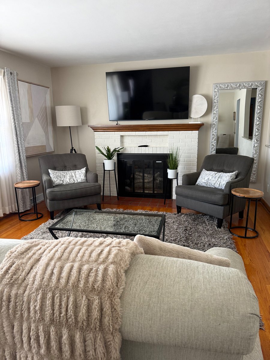 Large living room with 65-inch smart TV and high Wi-Fi internet.