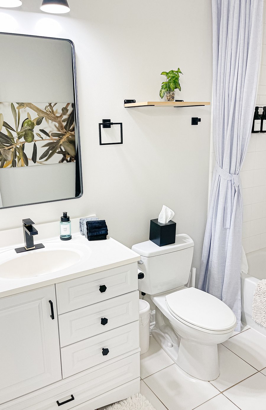 Clean, updated bathroom with full tub/shower and ample storage.