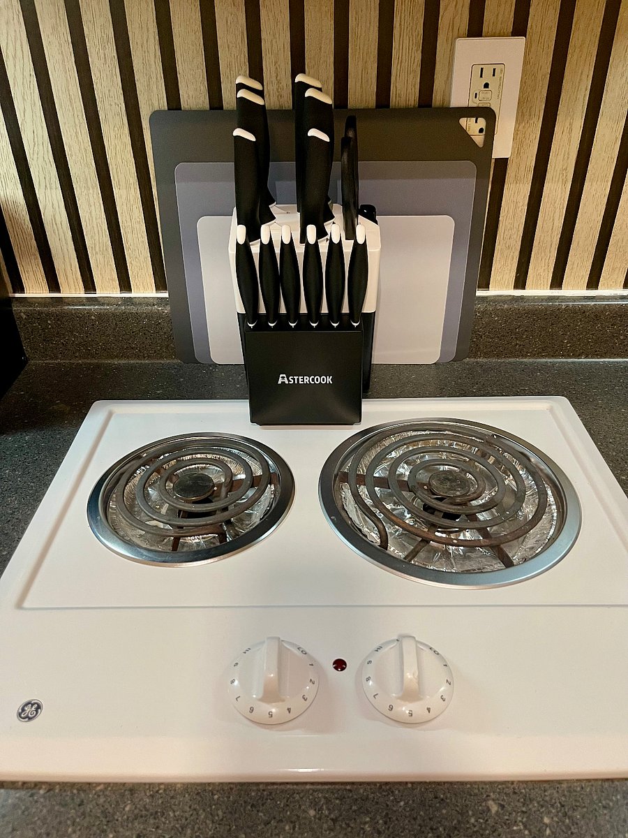 Full kitchen featuring stovetop, air fryer, toaster, and coffee machine