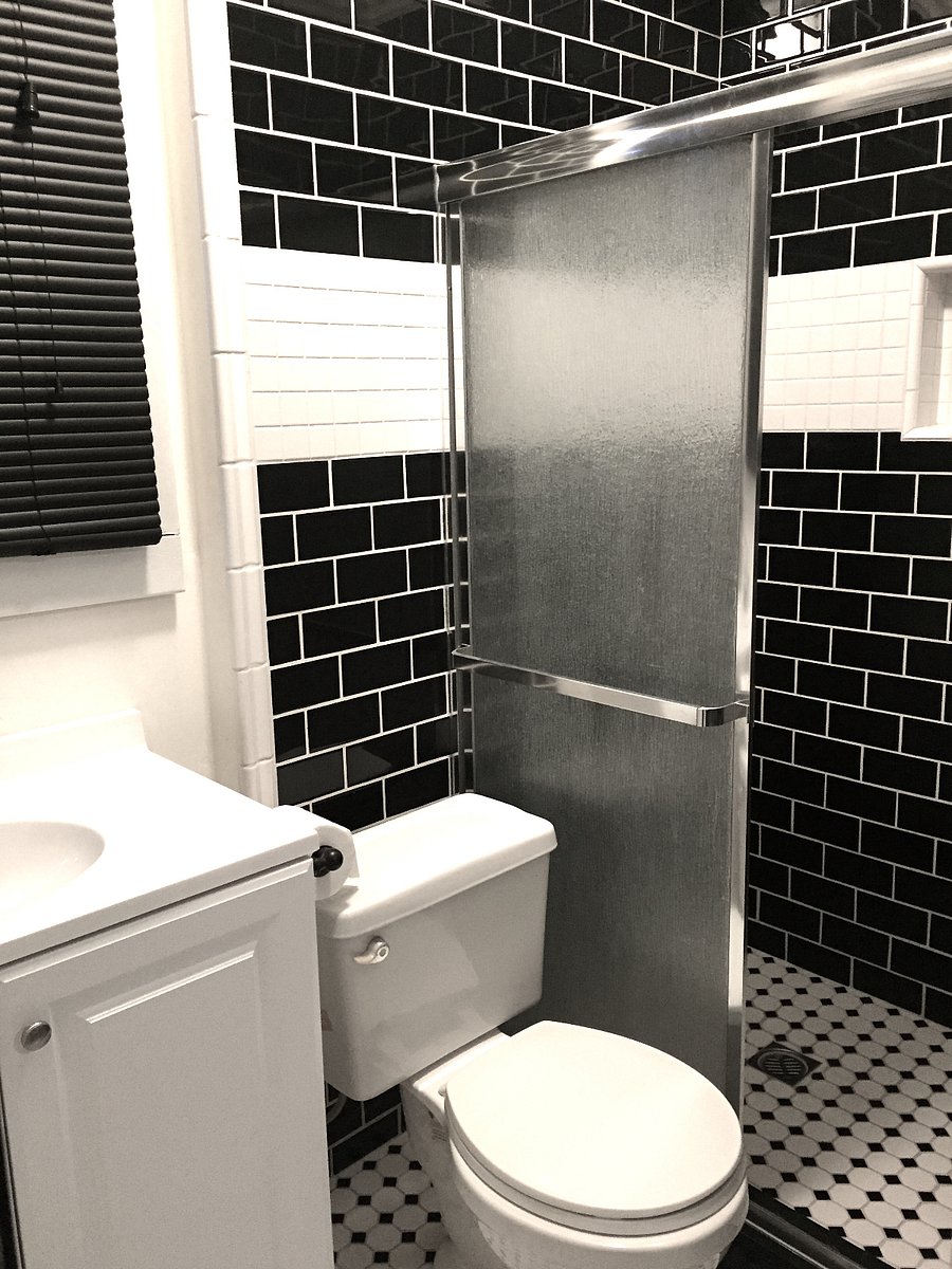 Art deco bathroom with shower.