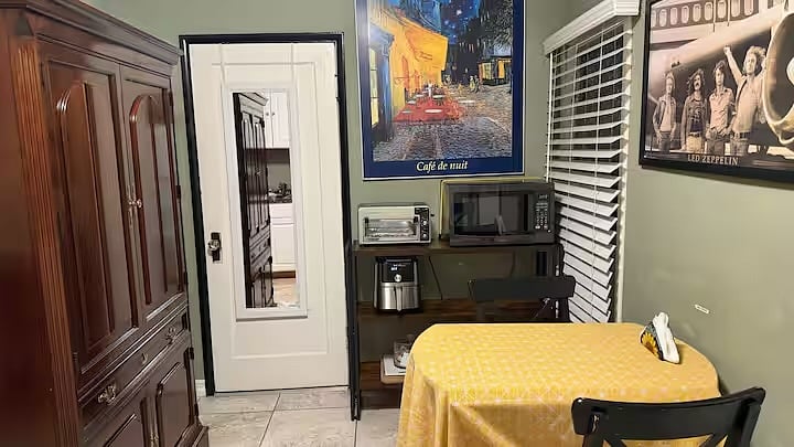 Dining area with toaster oven, microwave, air flyer. There is also hot plates and an electric fryer. 