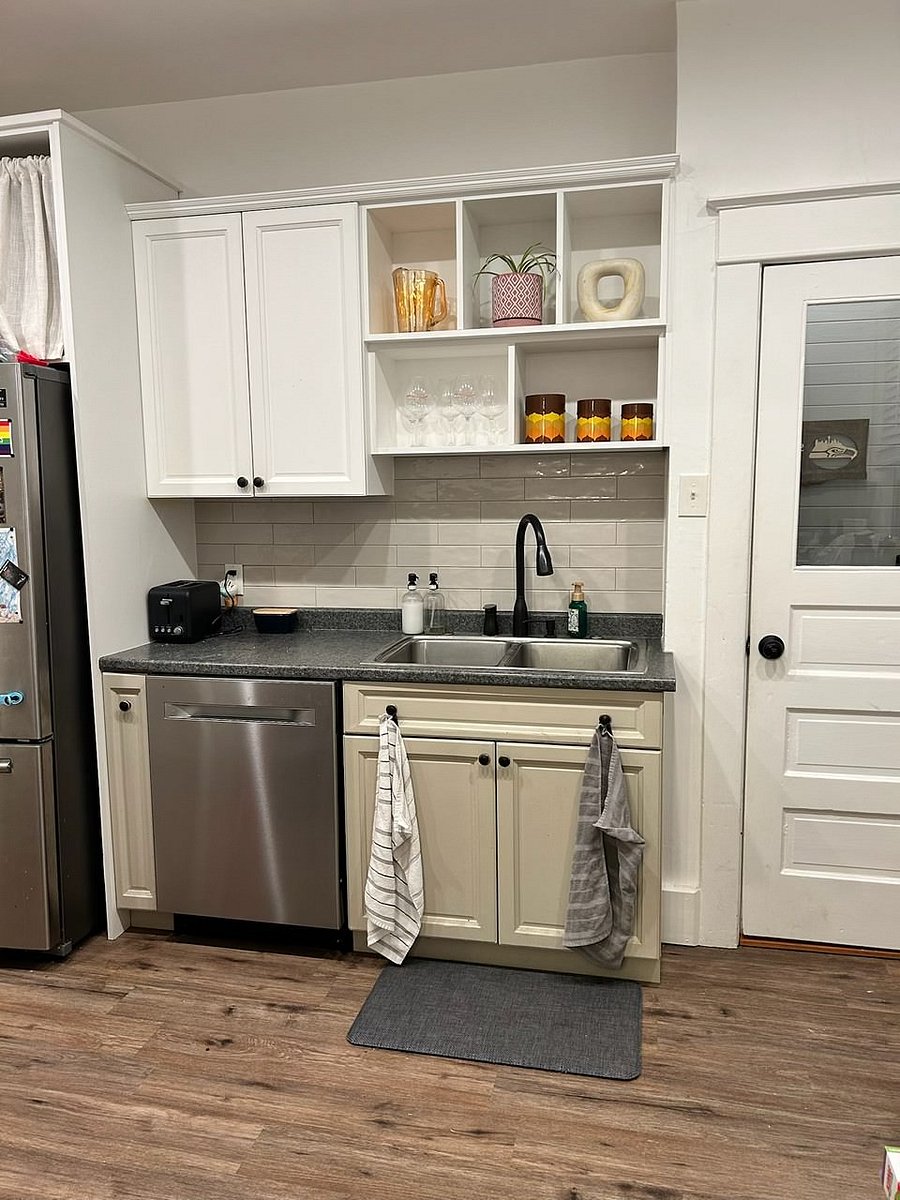 Kitchen (main floor); fully stocked with dishes, appliances (microwave, stove/oven, refrigerator, dishwasher), utensils, dishes, etc.