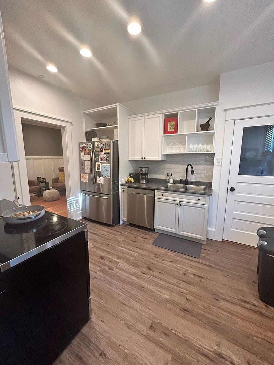 Kitchen (main floor); fully stocked with dishes, appliances (microwave, stove/oven, refrigerator, dishwasher), utensils, dishes, etc.