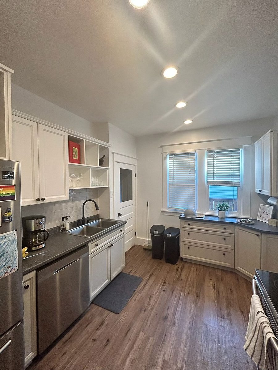 Kitchen (main floor); fully stocked with dishes, appliances (microwave, stove/oven, refrigerator, dishwasher), utensils, dishes, etc.