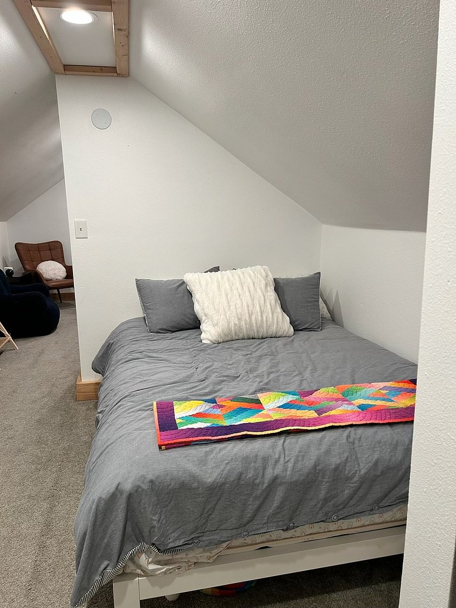 Hallway/alcove space upstairs; currently has queen bed in the alcove for extra sleeping space but bed can be swapped with office desk in the room next door if desired.