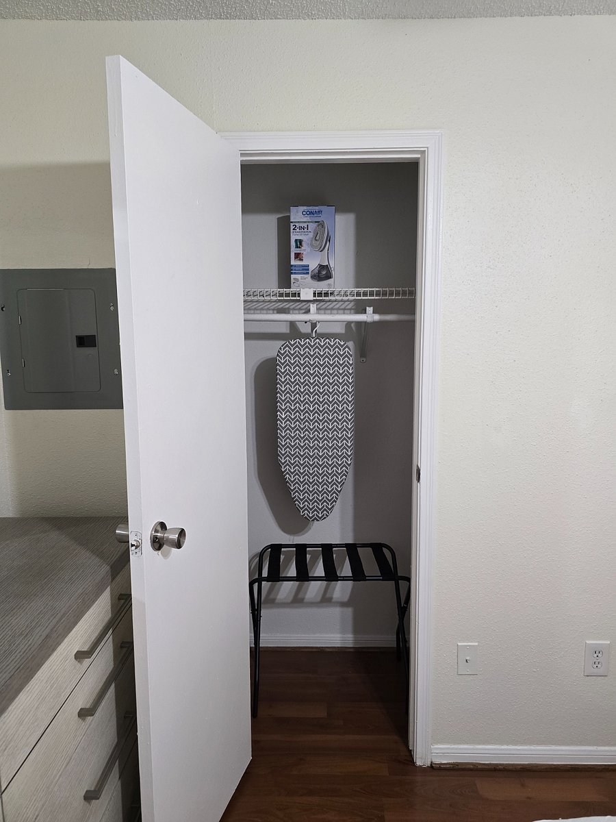 Iron, ironing board and luggage rack