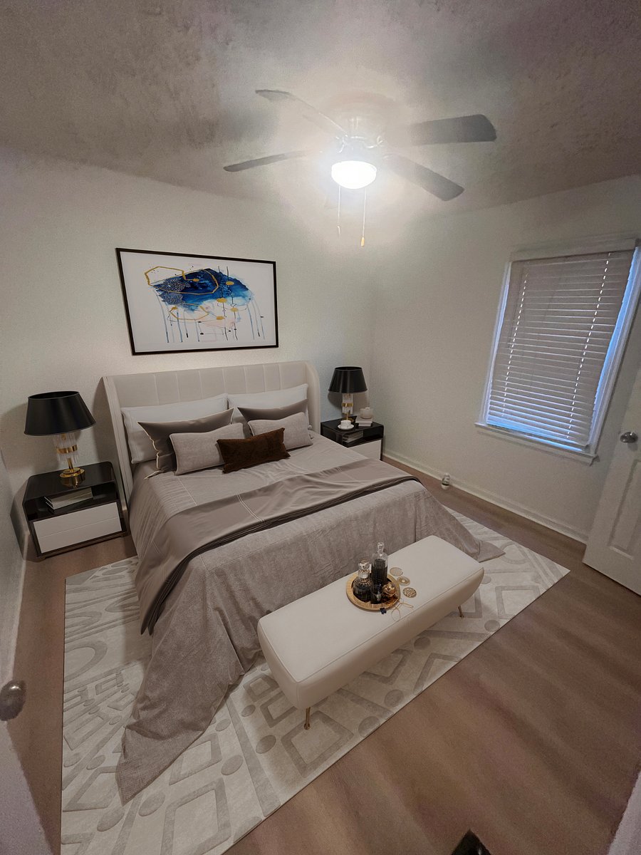 Bedroom with closet, ironing board and iron in the closet.
