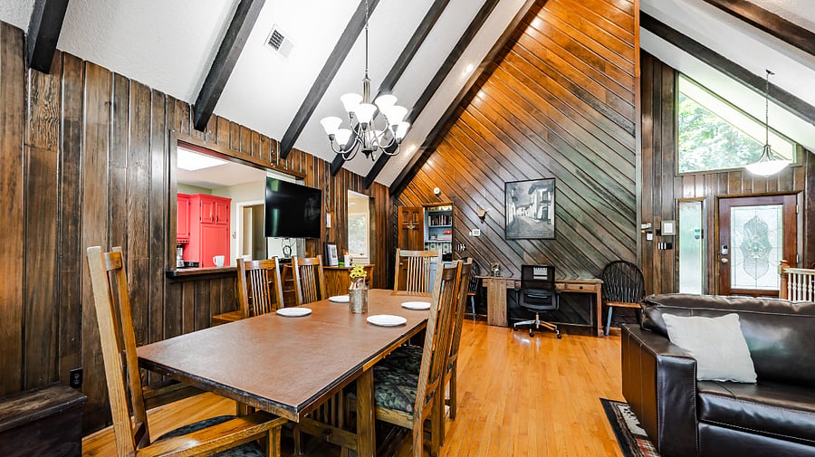 Open-plan living and dining area with vaulted ceilings