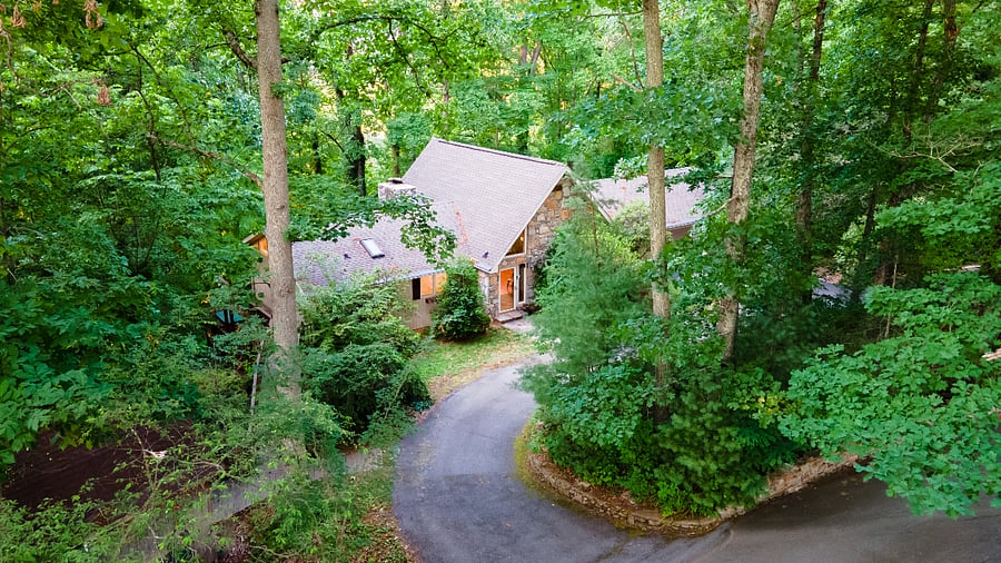 Private driveway and wooded setting