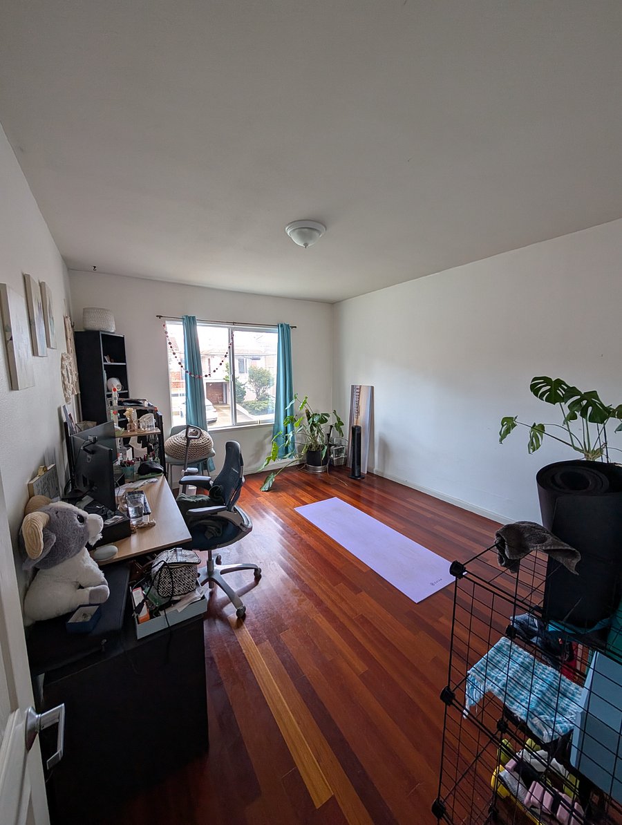 Shared spare room with desk, yoga mats, small weights, air mattress for guests