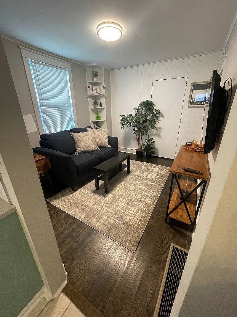 Living room decorations have been recently updated and there is a new sofa table, but the same cozy feeling pictured above remains!