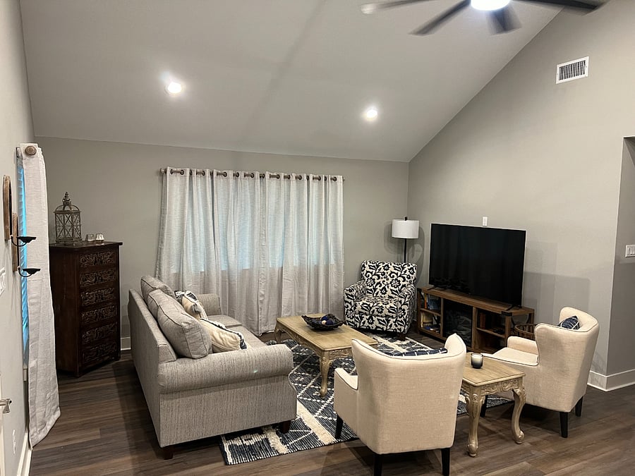 Living room with ample seating and 65 in TV