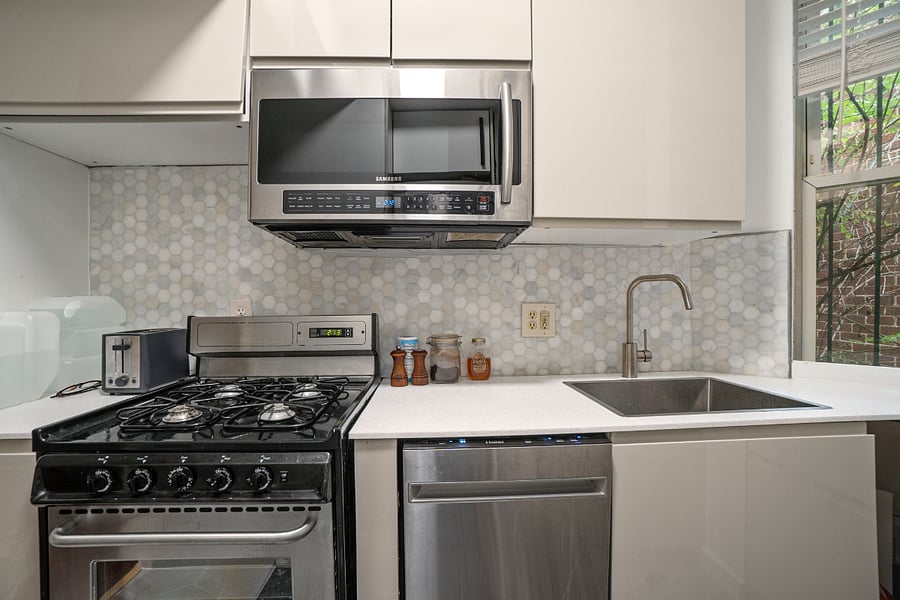 kitchen with gas stove, microwave, dishwasher