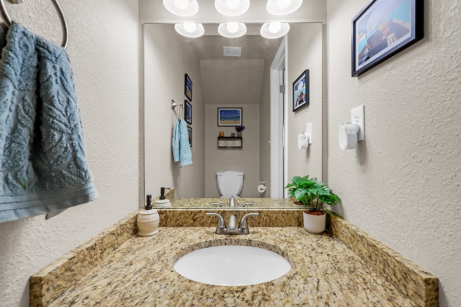 A downstairs half bath adds everyday convenience.