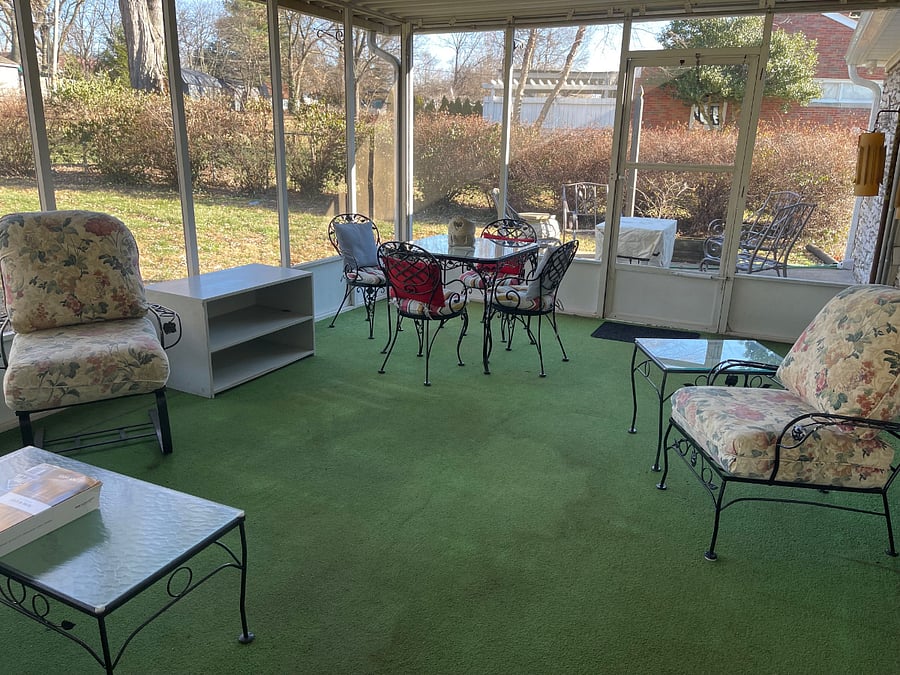 screened porch and view of patio with firepit/table