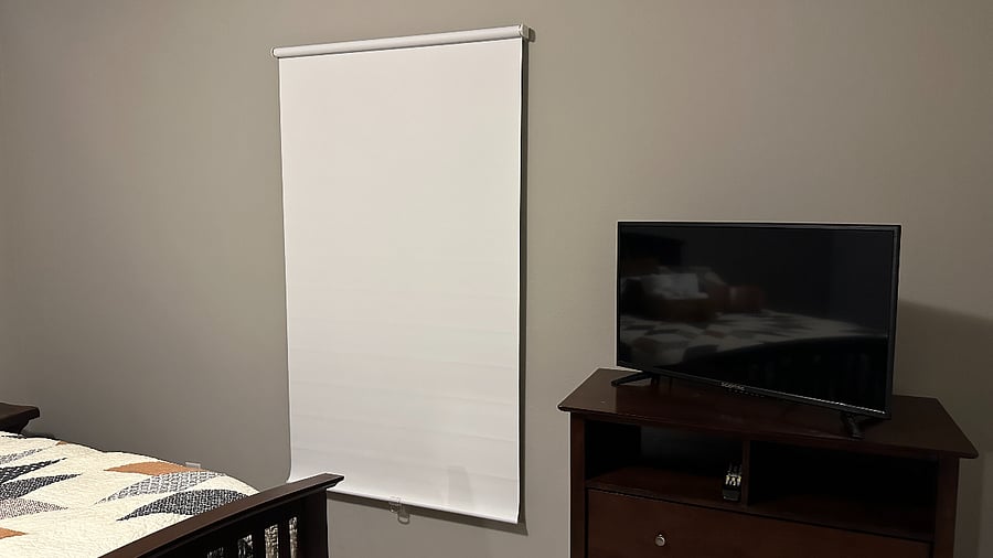 Window has a thermal, pull-down blackout shade for sunlight control.
