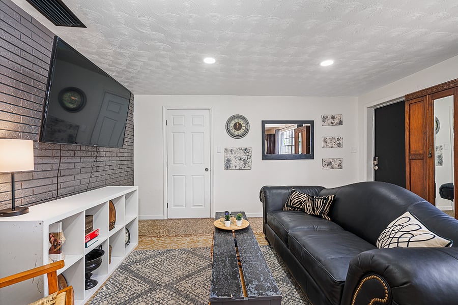 Living room view: front door is the black door on the right.