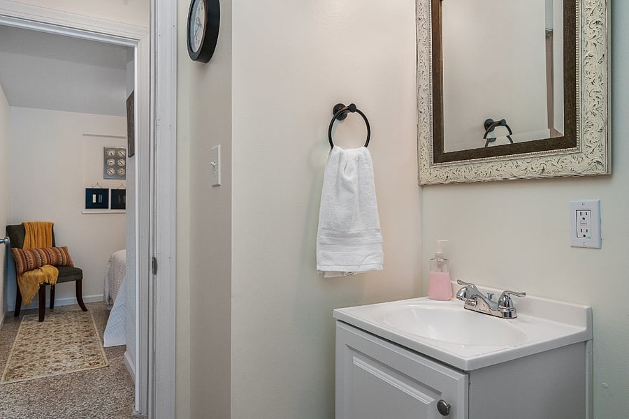 Bathroom and view of double bedroom.