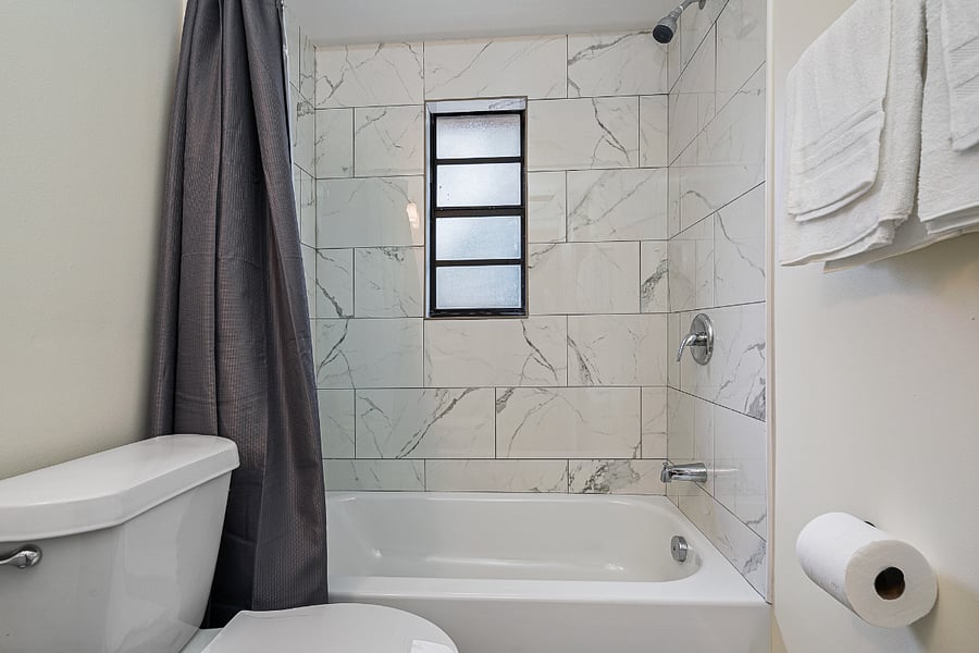 Newly remodeled bathroom with shower and tub.