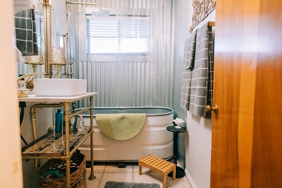 Full bathroom with deep tub and rain shower!